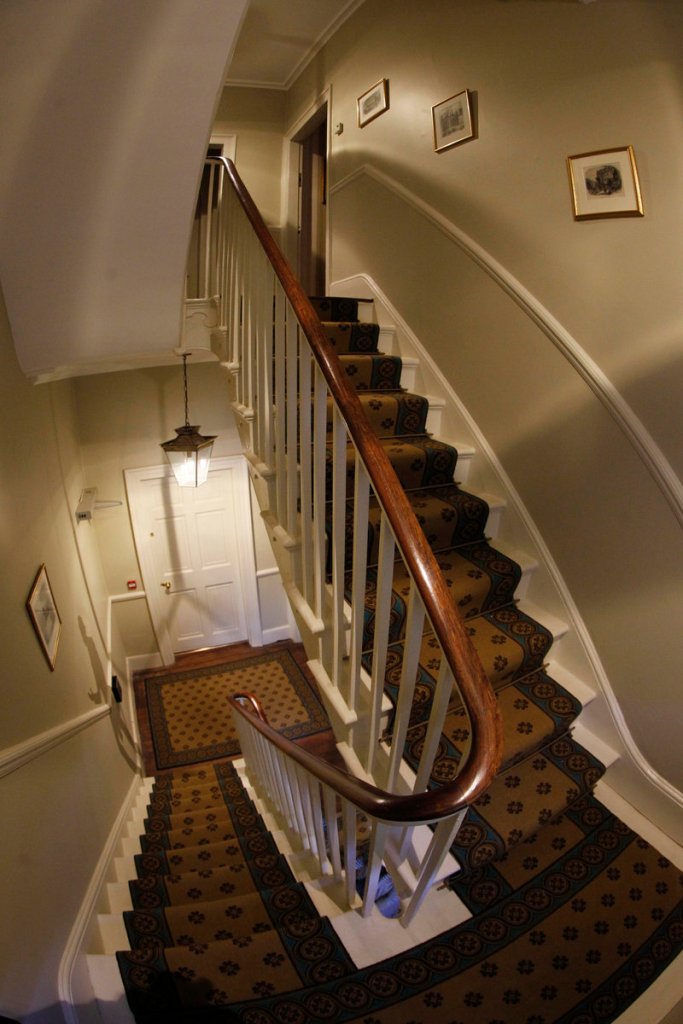 The staircase leads to the drawing room and bedrooms with other Dickens furnishings.