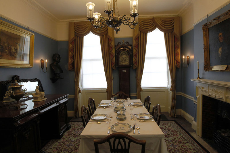 The orginal sideboard and a portrait of Dickens grace the dining room.