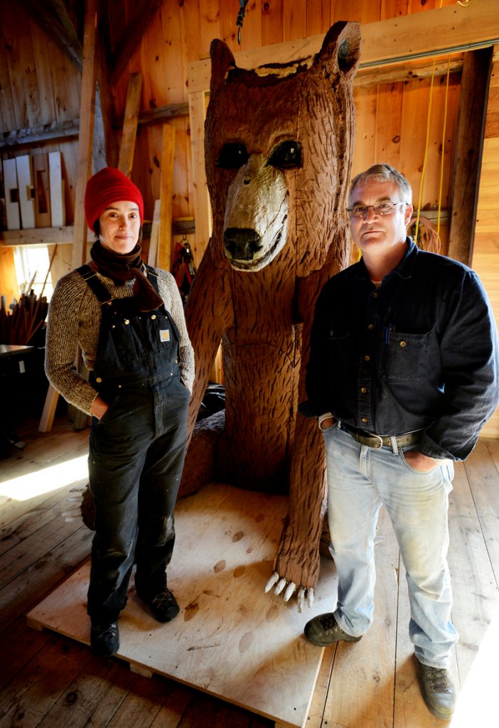 Arron Sturgis of Preservation Timber Framing in Berwick, with preservationist Jessica MilNeil, is working with the Ogunquit Museum of American Art to conserve a Bernard Langlais sculpture of a bear.