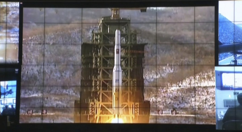 In an image made from video Wednesday, North Korea successfully launches its first rocket that can put a satellite into orbit at the General Launch Command Center on the outskirts of Pyongyang.