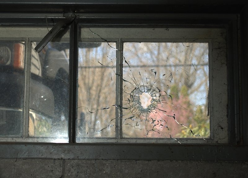 In this photo released by the New Hampshire Attorney General's Office shows a bullet hole from a basement window at a home in Greenland, N.H. Attorney General Michael Delaney said Friday Dec. 14, 2012 the hole came from a shot fired by Cullen Mutrie Aug. 12, 2012 that killed Greenland Police Chief Michael Maloney during a drug raid. (AP Photo/HO/NHAttorney General's Office)