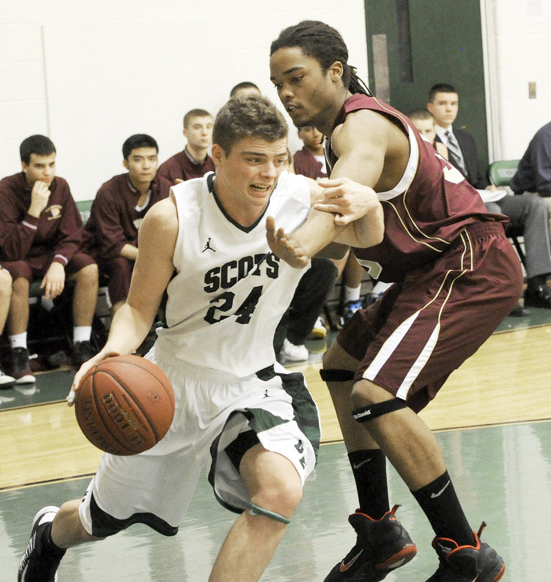 Jon Thomas drives against Malcolm Dopwell of Thornton Academy during Bonny Eagle’s 62-29 victory Friday night. The Scots are 3-0 heading into Tuesday’s game against Portland, which is also undefeated.