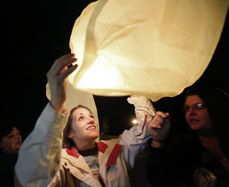 Trista Reynolds, Ayla’s mother, floats a lantern skyward during the Portland event Saturday. She says Justin DiPietro, Ayla’s father, “could end all of this within seconds if he would just be a father and actually speak for his daughter.”