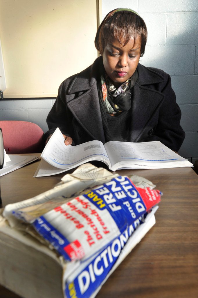 A heavily thumbed French-English dictionary sits in front of Francine Kaneza Nkomje, who was getting in some last-minute studying for an upcoming test before her English class at Portland Adult Education.