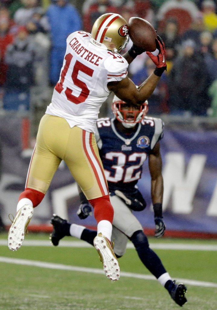 Michael Crabtree makes a catch against Devin McCourty and scores a touchdown in the third quarter. Crabtree later caught the winning TD pass in the fourth quarter.