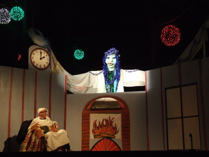 The Shoestring Theater’s production of “A Christmas Carol” features a dozen or so human actors – adults as well as children – and hand puppets, rod puppets, shadow puppets, carnival puppets and a stilt walker.