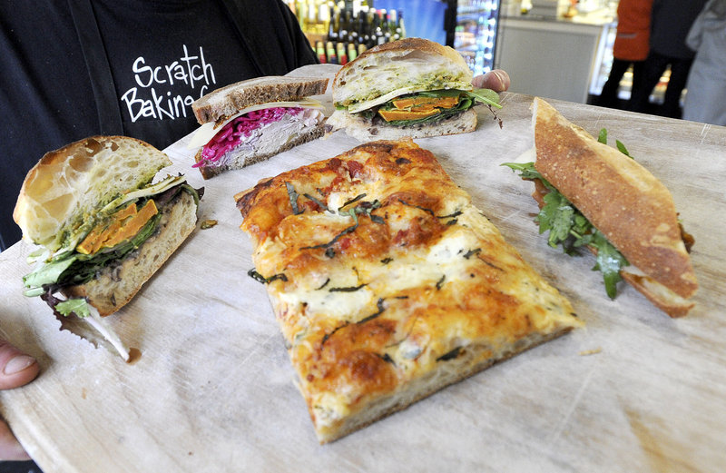 Three-cheese pizza and veggie and roast turkey sandwiches at Scratch Baking Co.