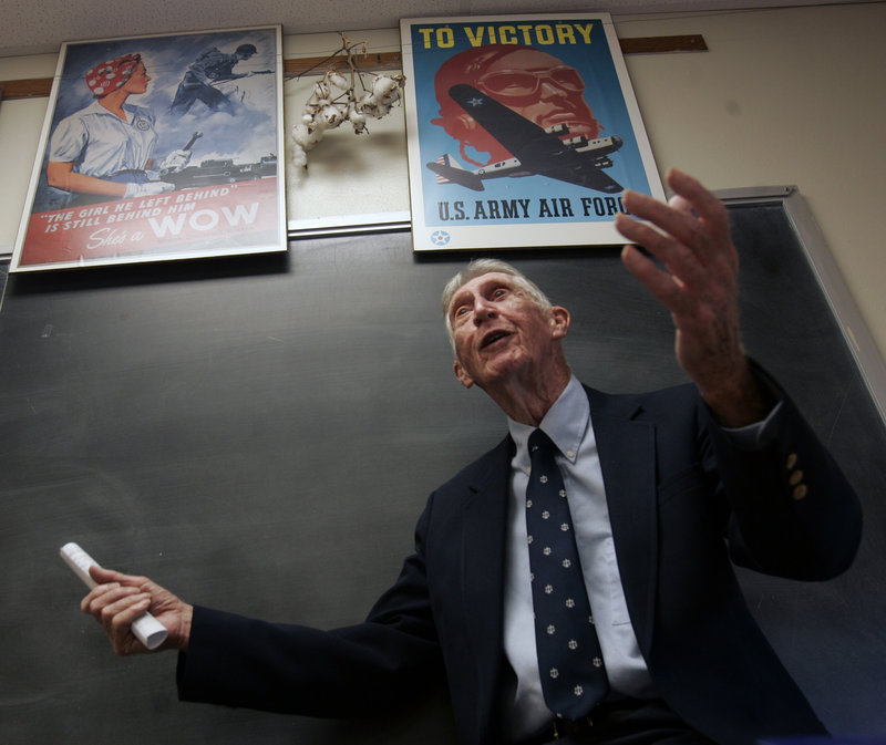 In this Sept. 13, 2007 file photo, Carrol Walsh talks to a history class at Hudson Falls High School in Hudson Falls, N.Y. The World War II combat veteran from New York, whose account of liberating Holocaust victims from a Nazi train led to reunions with the survivors 60 years later, has died. He was 91. (AP Photo/Mike Groll)