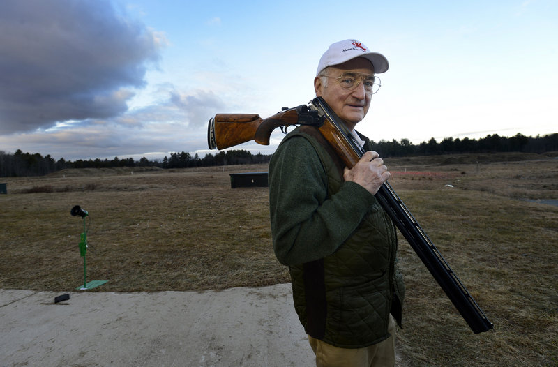 Fred Wiegleb, president of the 1,000-member Scarborough Fish and Game Association, carries his Beretta DT10 shotgun at the firing range Thursday. Wiegleb said he never sees semi-automatic assault-style firearms at the club.