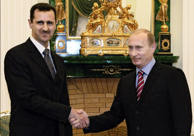 Russian President Vladimir Putin, right, and Syrian President Bashar Assad meet in Moscow in 2006. Putin is having a hard time hiding his frustration with Assad these days.