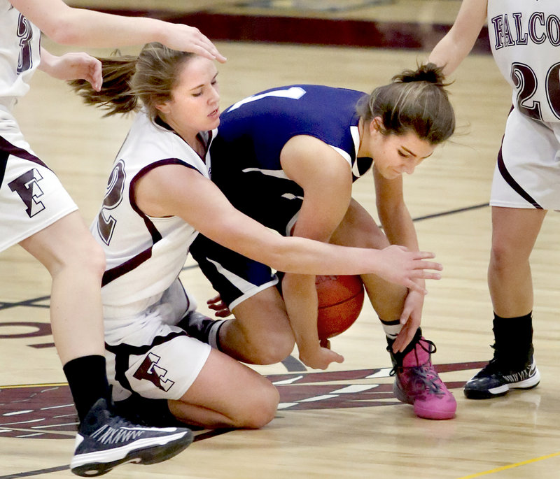 Jocelyn Davee, left, of Freeport and Ruby Cribby of York fight for a loose ball Thursday at Freeport. York improved to 6-0 but needed a second-half comeback to earn a 55-52 victory.