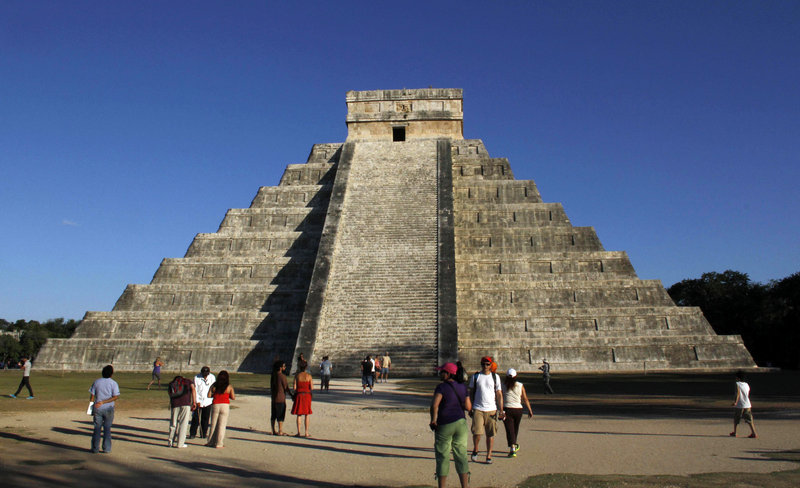The Mayan ruins at Chichen Itza, Mexico, attract visitors Thursday. Meanwhile, hundreds of spiritualists gathered at a convention center in the Yucatan city of Merida, an hour and a half away. “It is a cosmic dawn,” one declared.