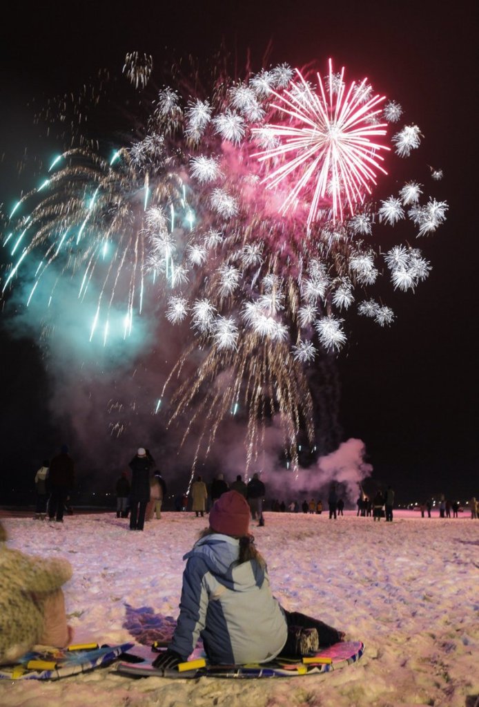Fireworks color the night sky in Old Orchard Beach on New Year’s Eve.