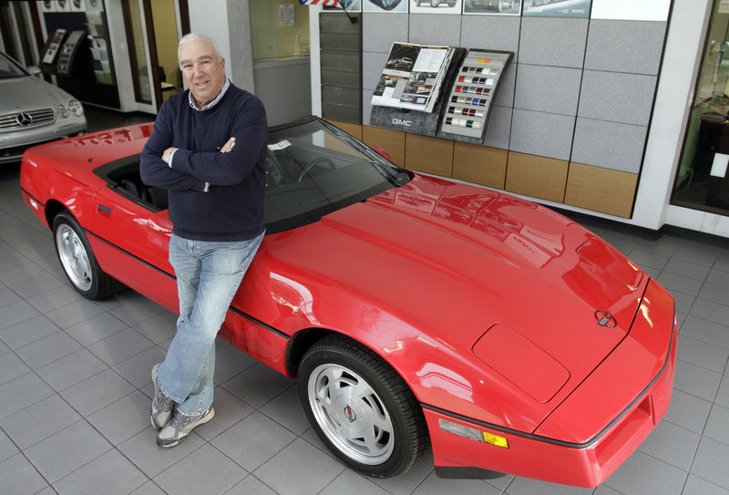 Corky Rice poses with a 1989 Corvette that authorities recovered in a self-storage facility. The car had been stolen in 1989 from a now defunct car dealership.