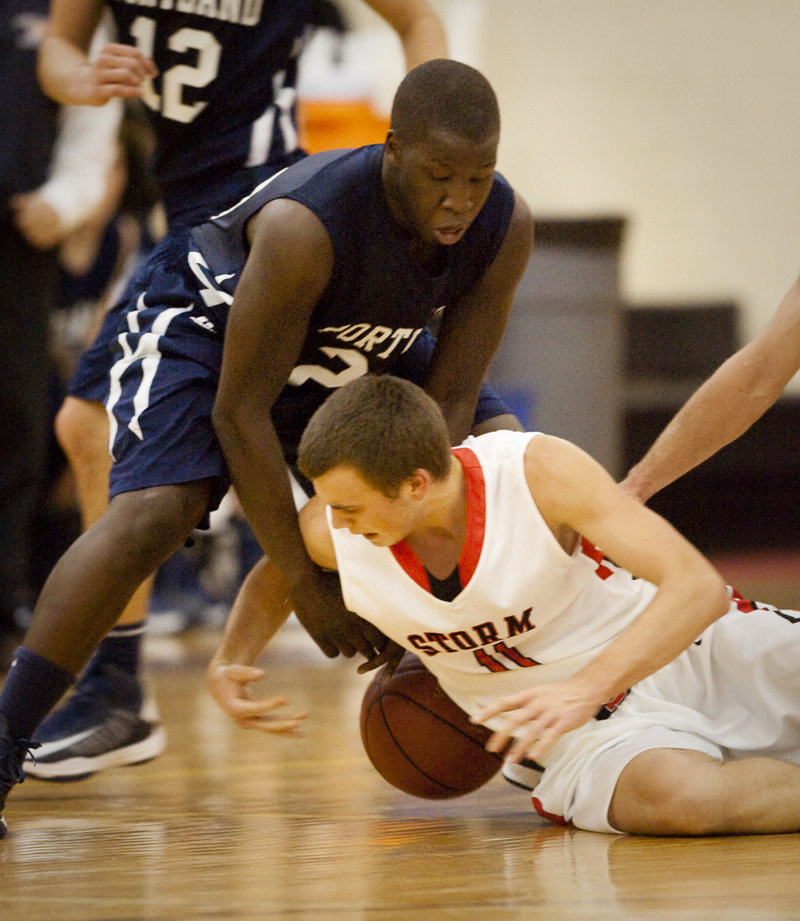 Sam Terry of Scarborough hits the floor to try to grab a loose ball against Portland’s Steve Angelo.