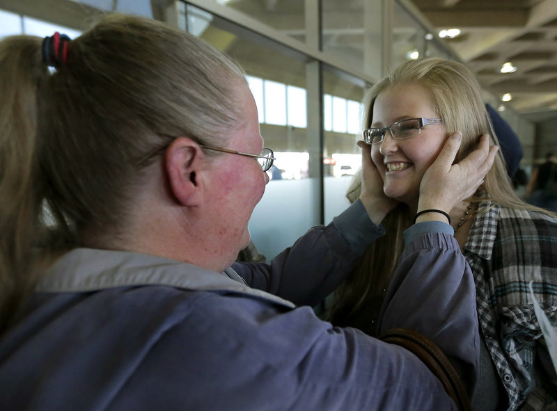 Diana Jones, left, takes a look at her daughter Sarah, 17, who weighed 74 pounds less after a four-month stay at a weight-loss boarding school. She attended with 13 students from the Independence, Mo., school district.