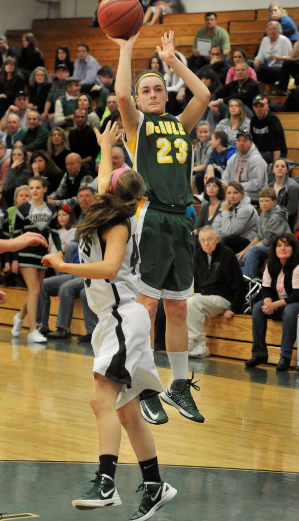 Allie Clement of McAuley shoots over Bonny Eagle’s Cassidy Emery. Clement made three 3-pointers and scored 22 points.