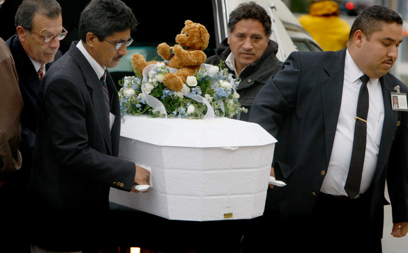 Pallbearers carry 4-year-old Roberto Lopez Jr.’s casket outside Our Lady of Angels Church in Los Angeles on Jan. 23, 2009. The boy was shot in the chest as he and his 5-year-old sister walked in a gang-plagued neighborhood. According to the Children’s Defense Fund, 299 children under the age of 10 were killed by guns in 2008 and 2009.