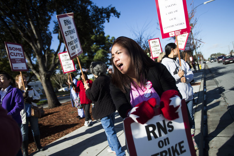 Yvette Grat, a nurse at Regional Medical Center of San Jose, takes part in a one-day strike Monday in San Jose, Calif. The protests were held at nine Bay area hospitals, which brought in replacement nurses.