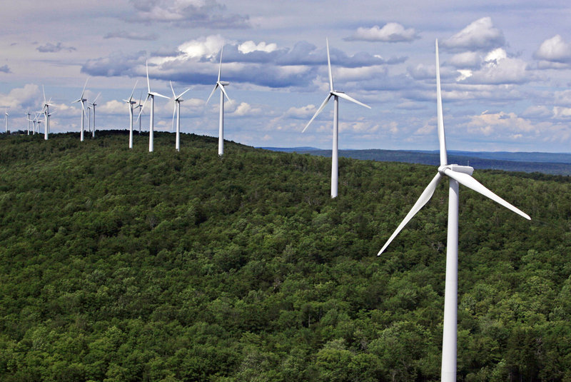 Wind turbines line a ridge on Stetson Mountain in Stetson. Proposed new wind power projects in Maine could get to market via a new transmission line that would require 150 miles of new wires and substations. 