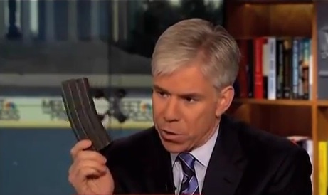 David Gregory, the host of NBC's "Meet the Press," holds what appears to be a high-capacity ammunition magazine on the show Sunday. Washington police are trying to decide whether he committed a crime.