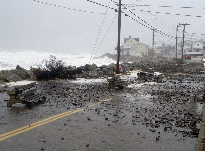 Police in Wells closed Webhannett Drive between Mile Road and the Crescent Beach area after surging waves from the nor’easter pushed debris into the road. Snow fell for more than 16 hours in areas of southern Maine.