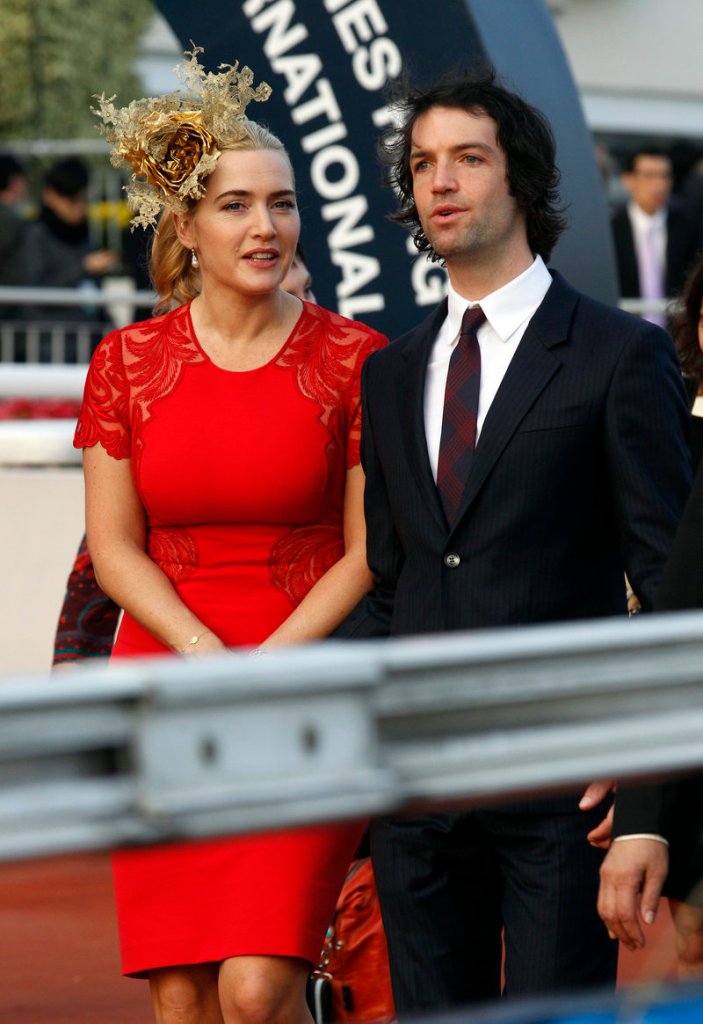 British actress Kate Winslet arrives with her then-boyfriend Ned Rocknroll for an awards presentation Dec. 9 at a Hong Kong racetrack. The couple married recently in a private ceremony in New York City.