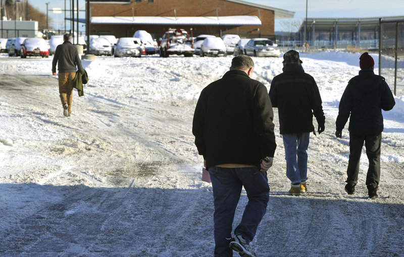 Portland residents retrieve their cars from the city's impound lot on Commercial Street on Friday, Dec. 28, 2012 after having them towed during the recent snowstorm.