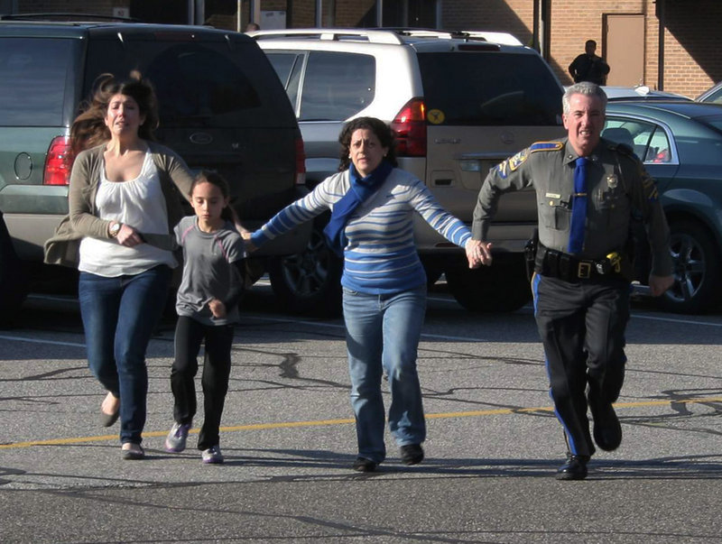 A police officer leads two women and a child from Sandy Hook Elementary in Newtown, Conn., shortly after Adam Lanza opened fire there Dec. 14, killing 26 people. The expansion of gun rights shows that “those who are equipped both with motivation and resources are likely to get their way,” a reader says.