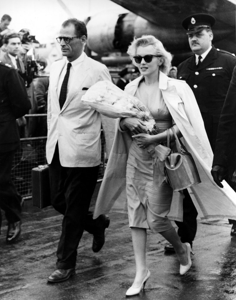 Marilyn Monroe and her husband, playwright Arthur Miller, arrive in London in 1956.