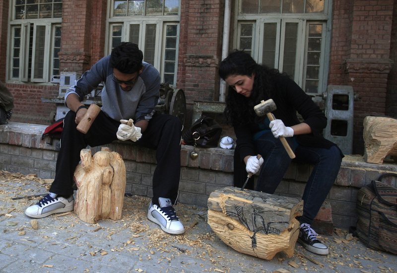 Pakistani students carve statues Dec. 6 at the National College of Arts in Lahore. A series of provocative paintings of Muslim clerics in scenes suggesting homosexuality has sparked an uproar and threats of violence by Islamic extremists. Space for progressive thought is shrinking in Pakistan as hard-line interpretations of Islam gain ground.