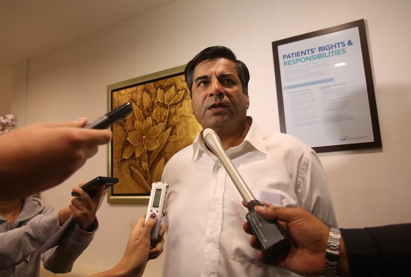 Indian High Commissioner to Singapore T.C.A. Raghavan speaks to reporters about the death of a young Indian woman at Mount Elizabeth Hospital in Singapore on Saturday. The woman had been gang-raped and severely beaten on a bus in New Delhi.