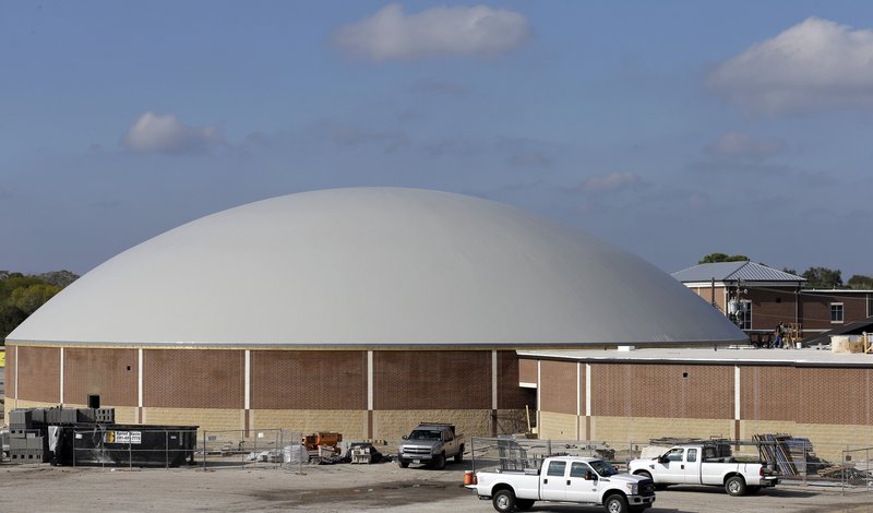 Work continues on the construction of a new domed gym at Edna High School in Edna, Texas. The hurricane dome is one of 28 such buildings planned to protect residents who might be unable to evacuate ahead of a hurricane.