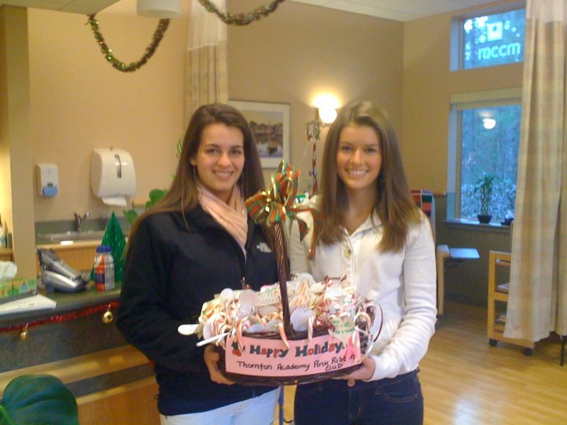 Thornton Academy seniors Sydney Kelly, left, and Delaney Seavey recently visited the Cancer Care Center of York County in Sanford to deliver some sweet holiday cheer just before the Christmas holiday. The girls came as representatives of the school’s Pink Ribbon Club.