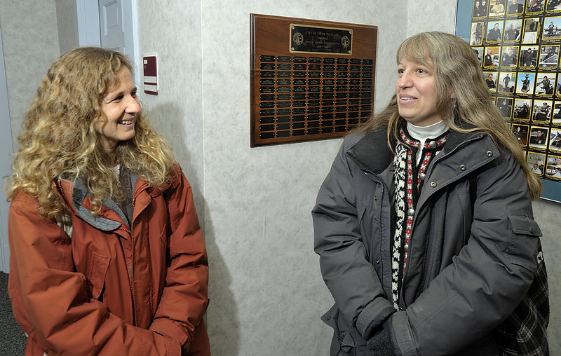 Together for 23 years, Laura Minervino, left, and Robin Elliott obtain their marriage license at South Portland City Hall on Saturday. They plan to wed next month.