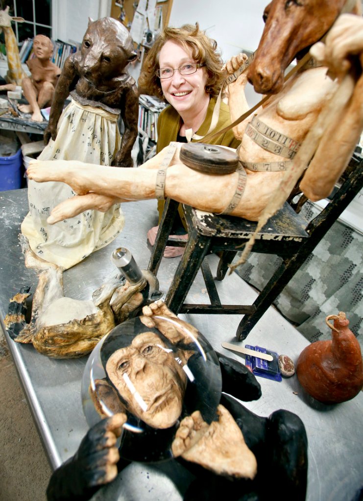 Cheryl Lichwell with her art created from ceramics and surface treatments in her studio.