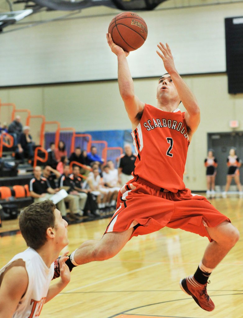 Dillon Russo of Scarborough puts up a shot Saturday at the end of a fast break during the Red Storm’s 60-50 victory against Biddeford.