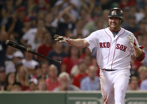 Boston Red Sox's Kevin Youkilis throws his bat after striking out to end the seventh inning of a baseball game against the New York Yankees in Boston, Sunday, Aug. 7, 2011. Youkilis has reportedly signed with the Yankees for a one-year, $12 million deal. (AP Photo/Michael Dwyer)