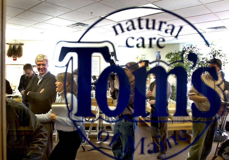 In this March 2006 file photo, Tom Chappell is seen through his store window for Tom's of Maine outlet in Kennebunk. The widely known Kennebunk-based producer of all-natural personal care products, has moved its research and development department to its parent company in New Jersey.