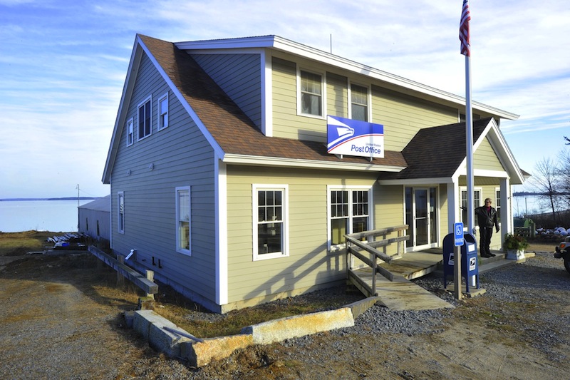In this Dec. 13, 2012 file photo, the Chebeague Island Post Office. The US Postal Service was proposing a reduction in island business hours despite widespread opposition from year-round residents, but island post offices in Maine will now stay open at least six hours a day.