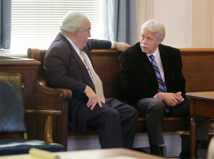 Mark Strong Sr., right, talks with his attorney, Dan Lilley, after Justice Nancy Mills dropped 46 charges against Strong at York County Superior Court in Alfred on Friday morning. Strong still faces 13 counts.