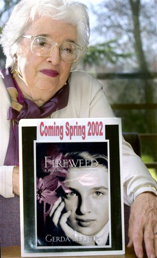 This 2001 photo shows Gerda Lerner, founder of University of Wisconsin-Madison's graduate program in women's history, with an image of her autobiography, Fireweed. Lerner, a founding member of the National Organization for Woman and a pioneer in the field of women�s history, has died at an assisted-living facility in Madison. She was 92. (AP Photo/Wisconsin State Journal, Sarah B. Tews) FRONT;A1;BOOK;UW;HISTORY