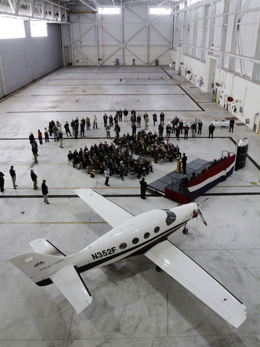 In this February 2011 file photo, Kestrel Aircraft Company shows off one of its planes during a ceremony at the former Brunswick Naval Air Station. Officials in Brunswick say the LePage administration appears to be meddling in a tax dispute between the town and the agency that's redeveloping the former air station. The complaint centers on L.D. 492, a bill the LePage administration submitted to clarify the law exempting some aviation companies like Kestrel from paying property taxes. (AP Photo/Pat Wellenbach)