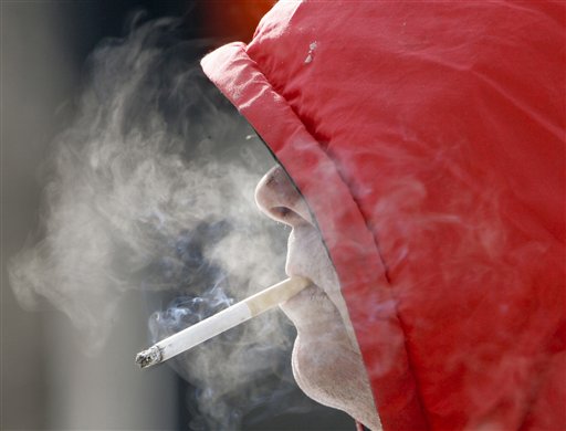 In this 2007 file photo, Omaha resident Charlie Waters has a cigarette. The American Lung Association of the Northeast is calling for a $1.50-per-pack increase in the cigarette excise tax in Maine to encourage smokers to quit and deter others from picking up the unhealthy habit. (AP Photo/Nati Harnik)
