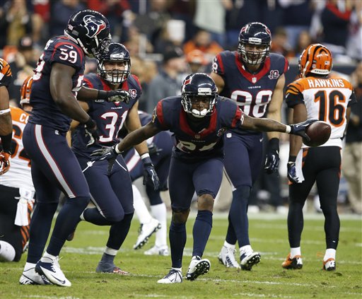Houston Texans running back Arian Foster (23) celebrates a first down during the second half of the Texans' AFC Playoff game against the Cincinnati Bengals on Saturday.