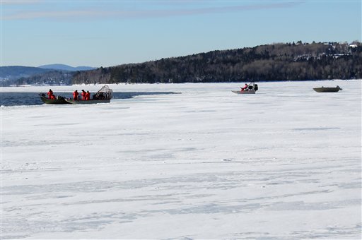 In this photo provided by the Maine Warden Service, wardens begin recovery operations for the three missing snowmobilers presumed to be in Rangeley Lake, Thursday, Jan. 3, 2013, in Rangeley, Maine. The warden service plans to use a remotely operated underwater vehicle to continue the search for the missing men, who are believed to be dead.