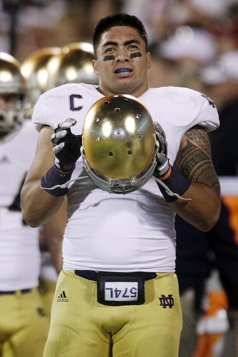 In this Oct. 27, 2012, file photo, Notre Dame linebacker Manti Te'o stands on the sidelines during an NCAA college football game against Oklahoma in Norman, Okla. Notre Dame issued a release Wednesday, Jan. 16, 2013, saying a story about Te'o's girlfriend dying, which he said inspired him to play better as he helped the Fighting Irish get to the BCS title game, turned out to be a hoax apparently perpetrated against the linebacker. (AP Photo/Sue Ogrocki, File) NCAA