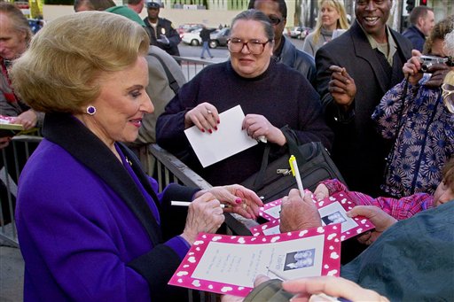 In this 2001 photo, "Dear Abby" advice columnist Pauline Friedman Phillips, known to millions of readers as Abigail van Buren, signs autographs for fans after the dedication of a "Dear Abby" star on the Hollywood Walk of Fame in Los Angeles.