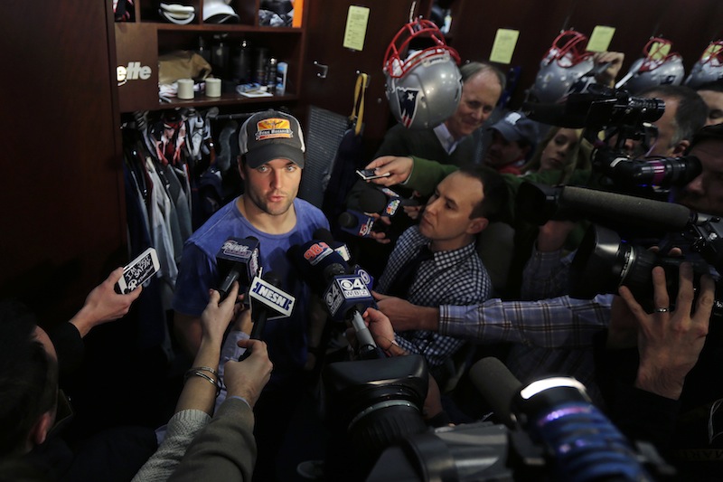 New England Patriots wide receiver Wes Welker is surrounded by members of the media in the locker room after an NFL football practice in Foxborough, Mass., Wednesday, Jan. 2, 2013. (AP Photo/Charles Krupa)
