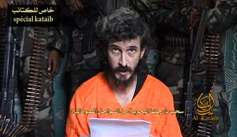In this undated file image from a video posted on Islamic militant websites and made available June 9, 2010, a man identified as a French security agent with the cover name of Denis Allex pleads for his release from the Somali militant group al-Shabab. President Obama said Sunday that U.S. military fighter jets provided backup support to a failed French mission to rescue Allex, who is presumed dead.